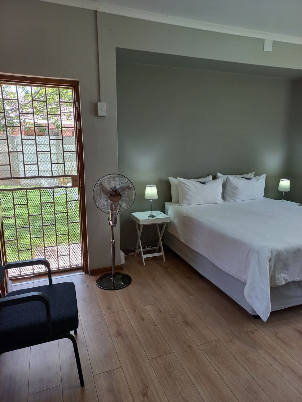 A guest room opening onto the garden at Oase Guesthouse